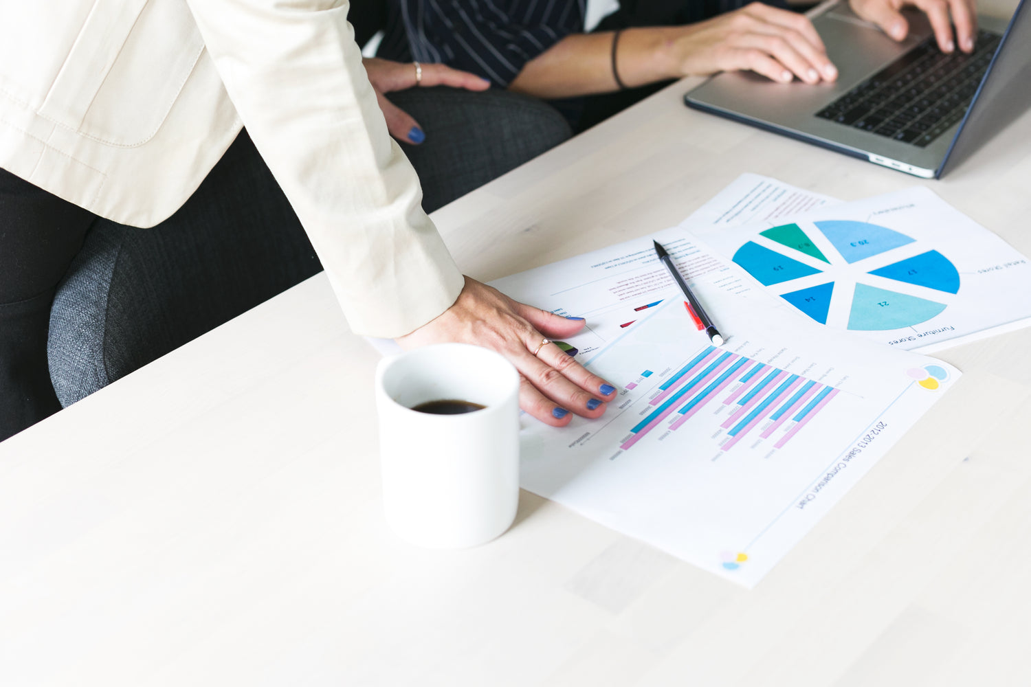 office woman hands on data sheets