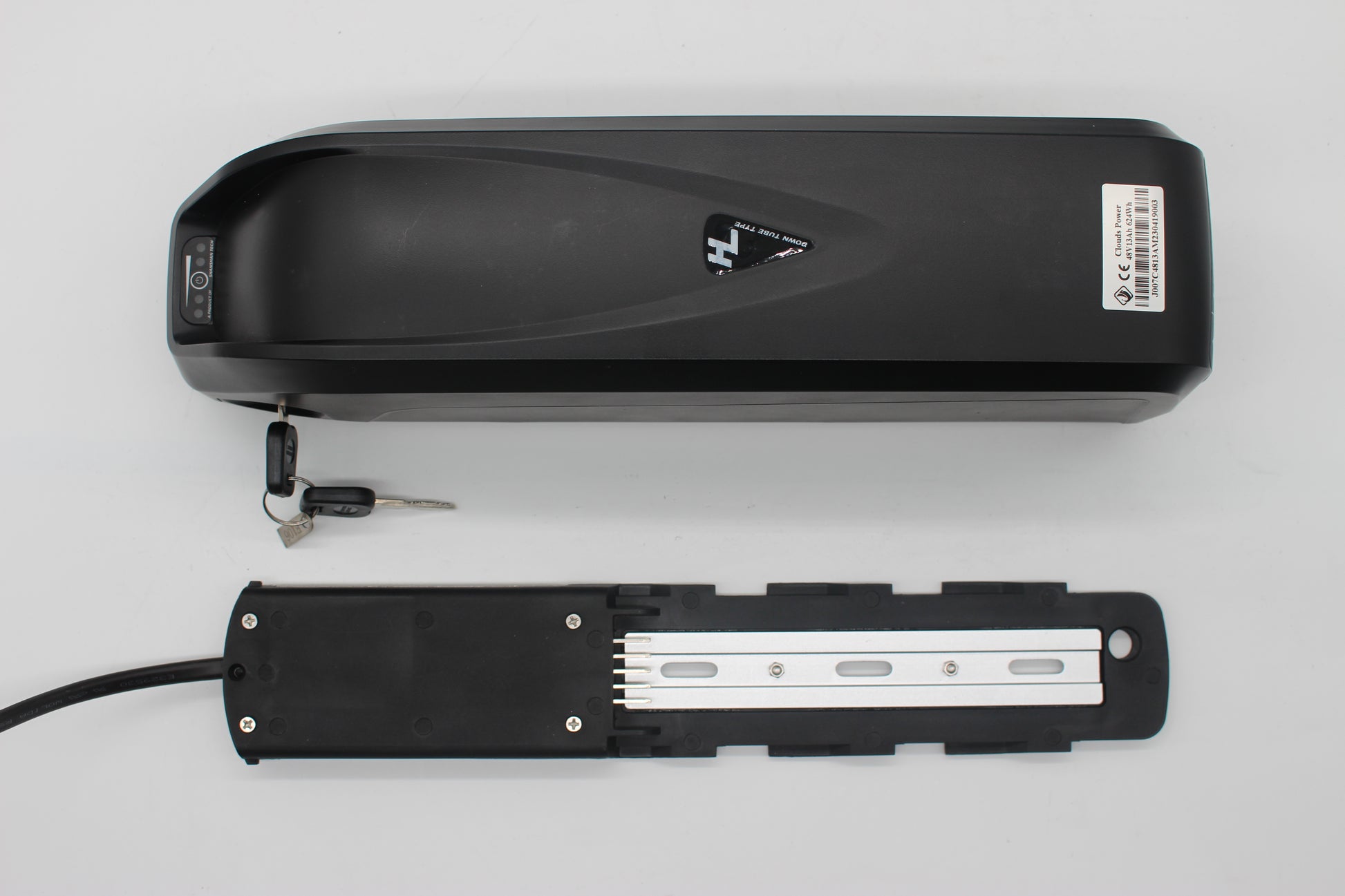 Black electric bike e-bike battery with a key on a light gray background