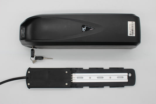 Black electric bike e-bike battery with a key on a light gray background